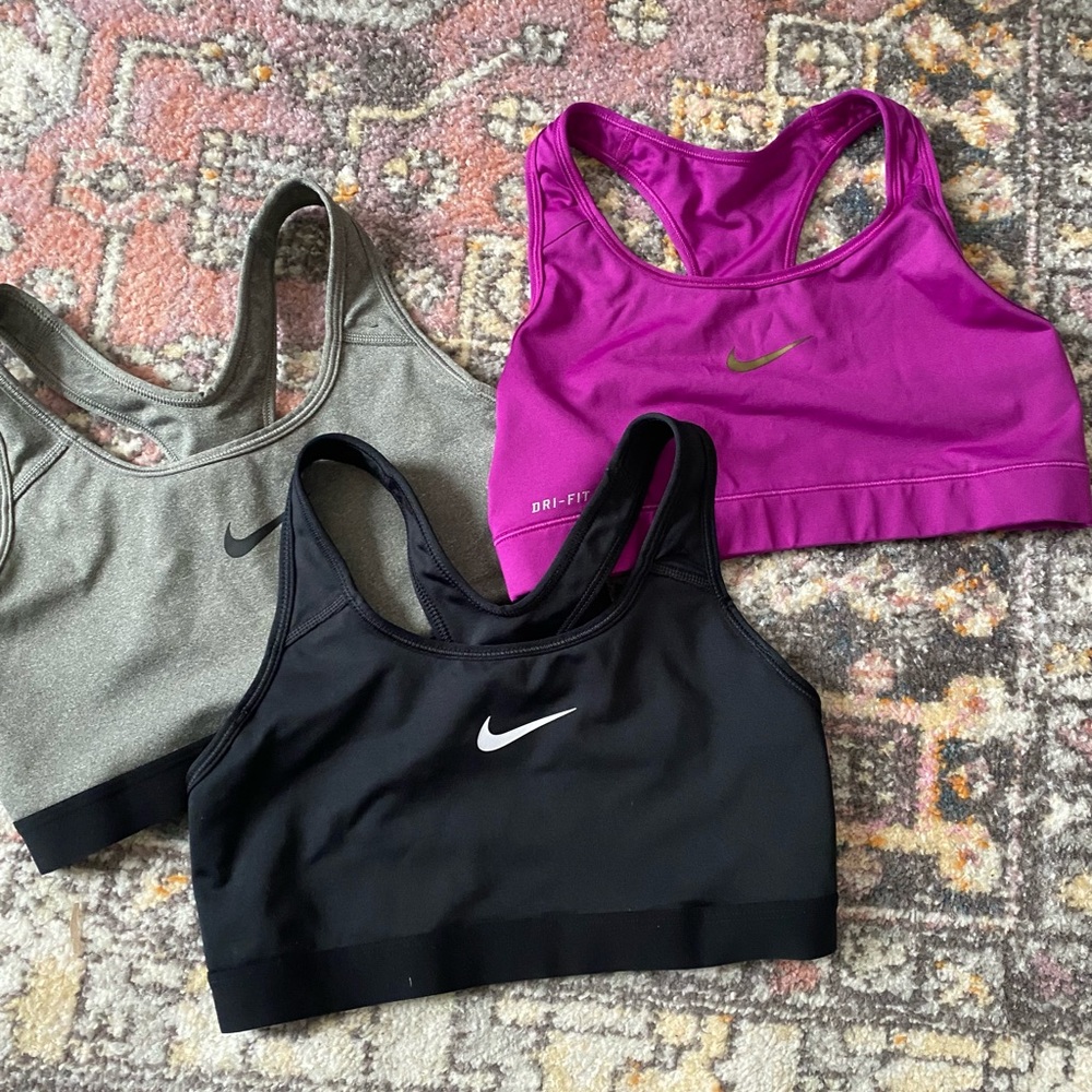 Three Nike dry fit sports bras